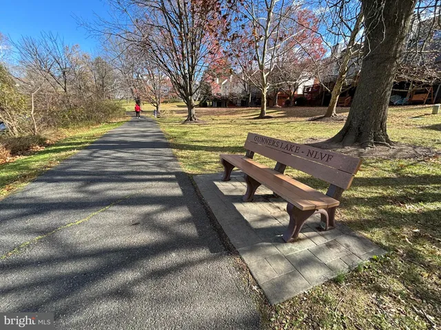 a view of a yard with swimming pool and sitting area