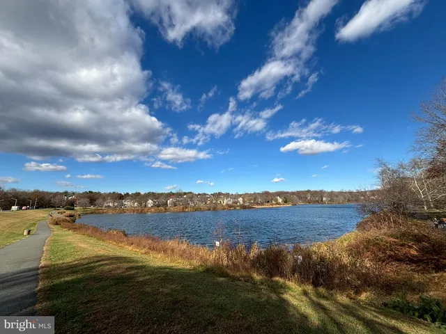 a view of lake with sunset