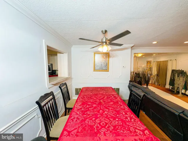 a view of a hallway with seating area