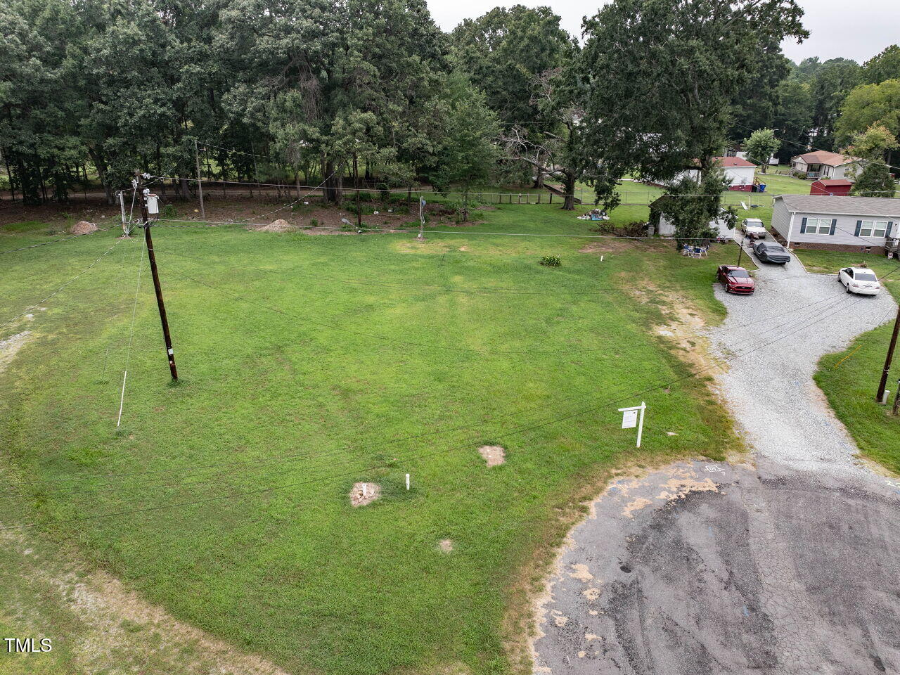 224 Holiday Park Road Hillsborough, NC 27278 - Photo 2 of 11 a backyard of a house with lots of green space