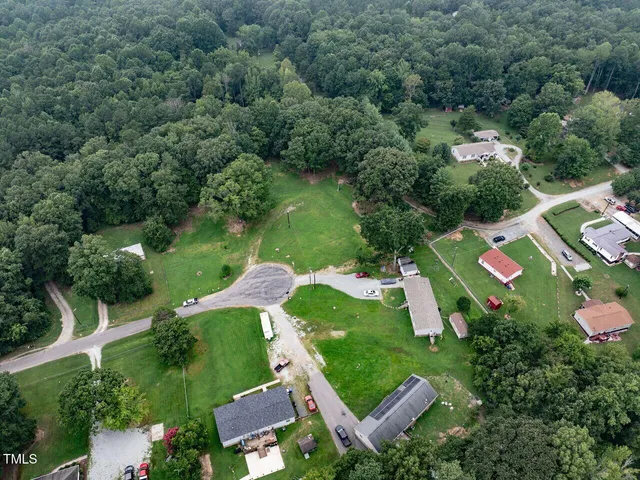 an aerial view of a house with a garden