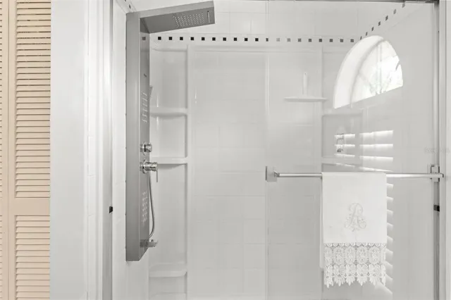 a fireplace with a vase and a clock on it