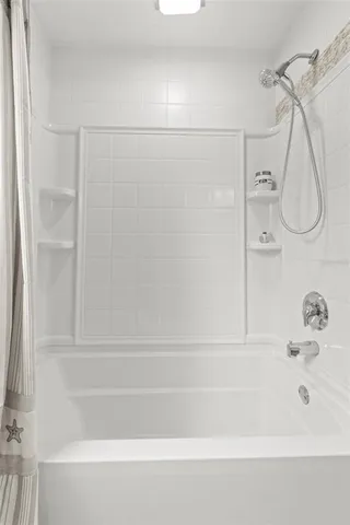 a bathroom with a sink a toilet a mirror and vanity