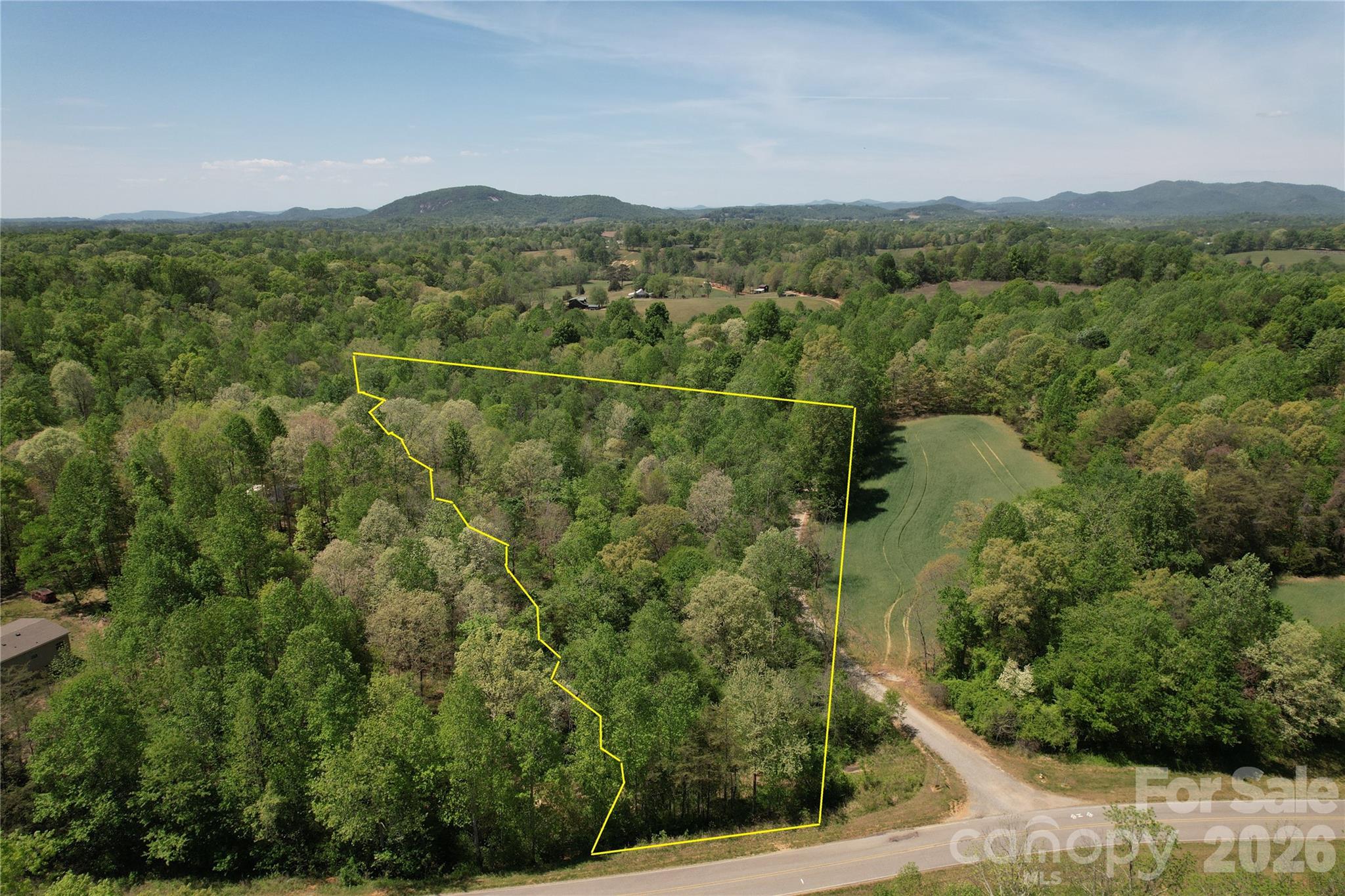 6 Hopewell Church Road, Unit 6 Hiddenite, NC 28636 - Photo 5 of 33 a view of a green field with mountains in the background