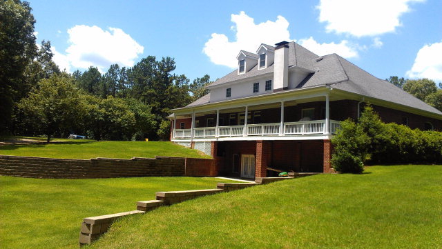 1607 Pate Road Juliette, GA 31046 - Photo 44 of 45 a view of a house with a big yard and large trees
