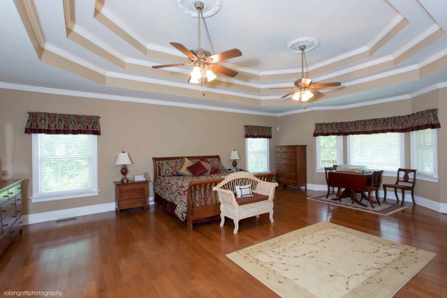 1607 Pate Road Juliette, GA 31046 - Photo 8 of 45 a living room with furniture a rug and a chandelier