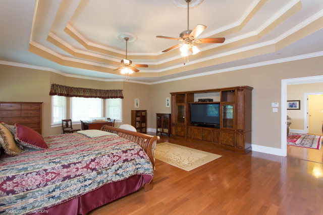 1607 Pate Road Juliette, GA 31046 - Photo 9 of 45 a bedroom with a bed and a flat screen tv