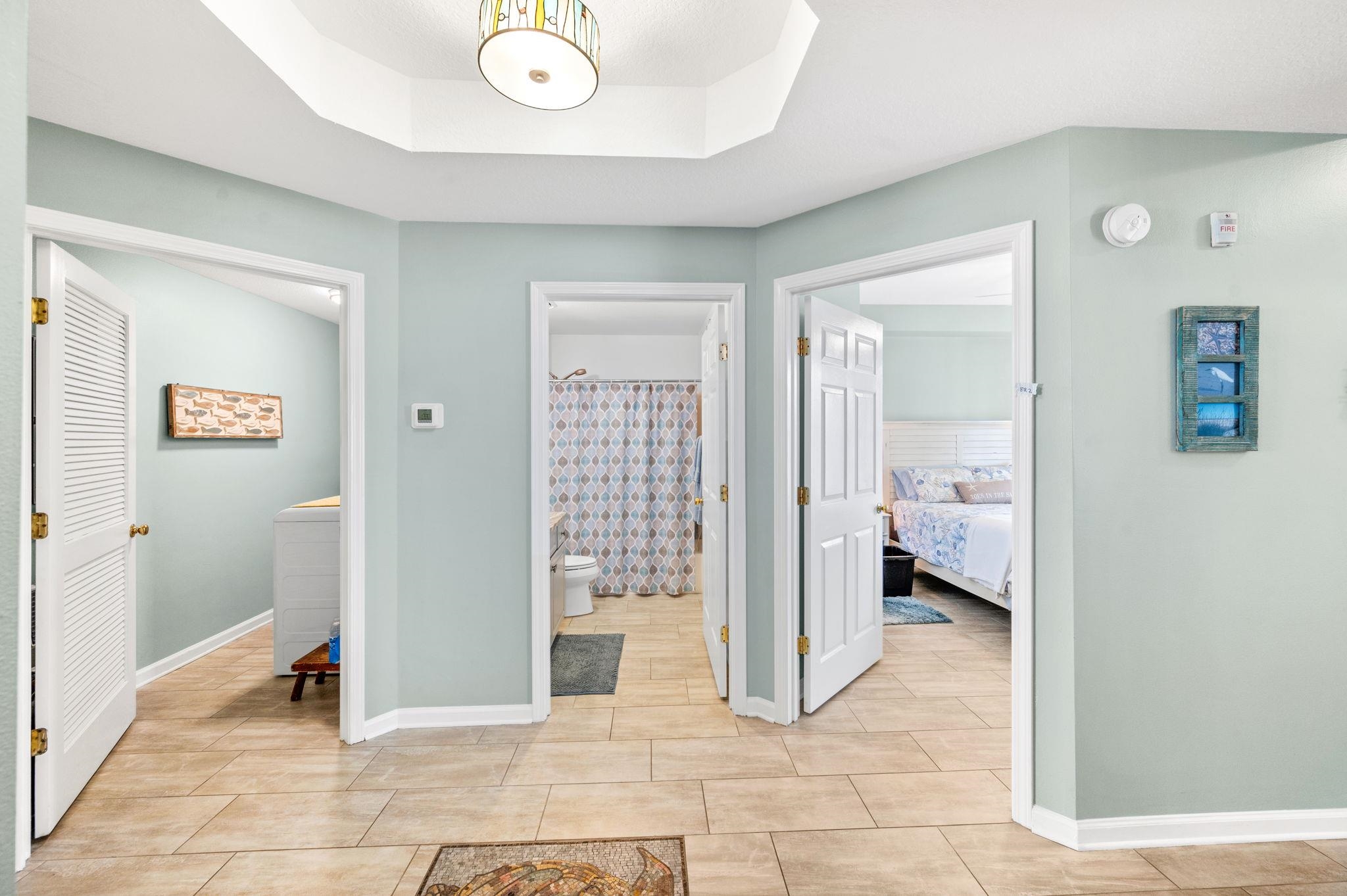 285 Atlantis Circle, Unit 203 St. Augustine, FL 32080 - Photo 32 of 66 a view of a hallway with bathroom and glass door