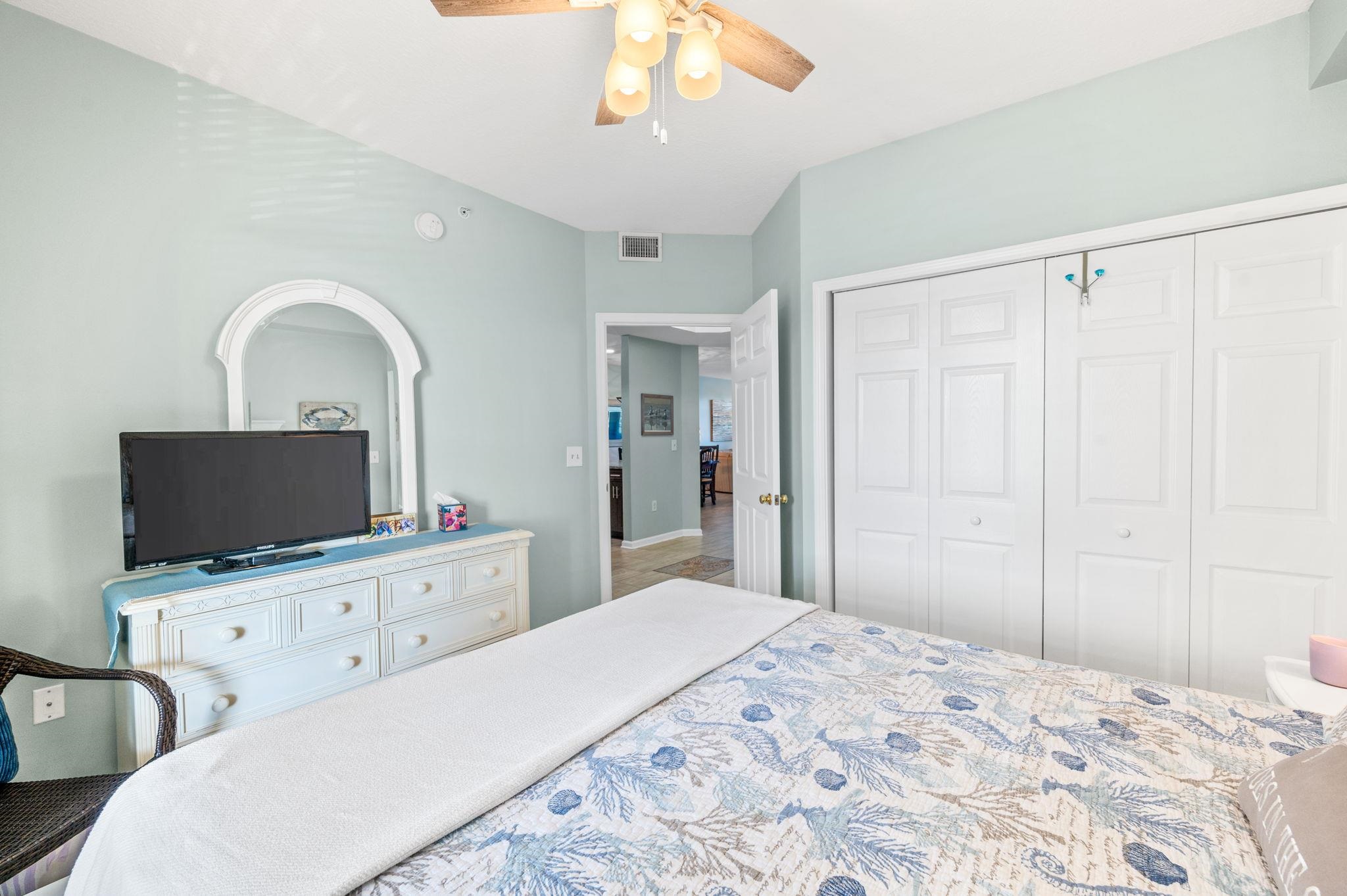 285 Atlantis Circle, Unit 203 St. Augustine, FL 32080 - Photo 35 of 66 a bedroom with a bed and a flat screen tv