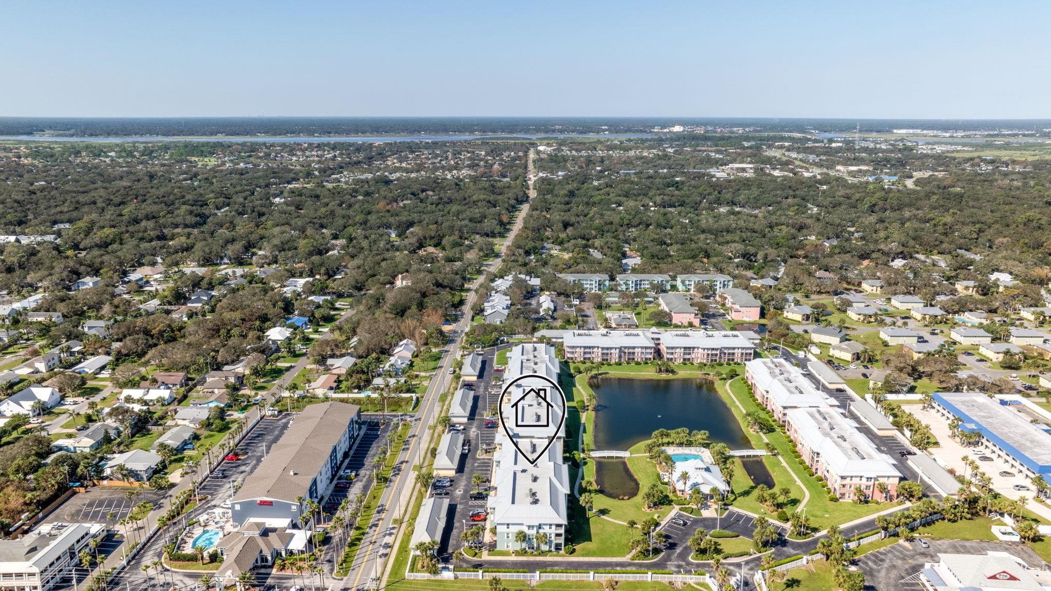 285 Atlantis Circle, Unit 203 St. Augustine, FL 32080 - Photo 60 of 66 an aerial view of residential building with parking space