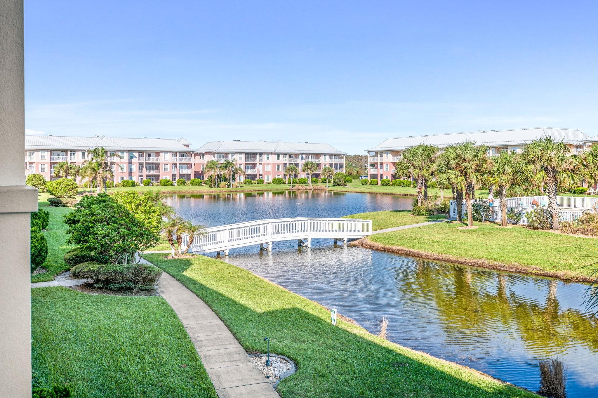 285 Atlantis Circle, Unit 203 St. Augustine, FL 32080 - Photo 9 of 66 a view of a swimming pool with an outdoor seating and a yard