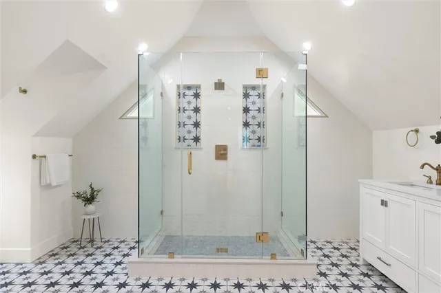 a bathroom with a shower and a sink