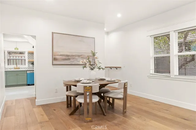 a view of a dining room with furniture and window
