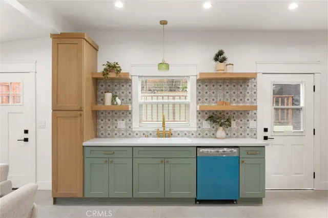 a kitchen with a sink and a window