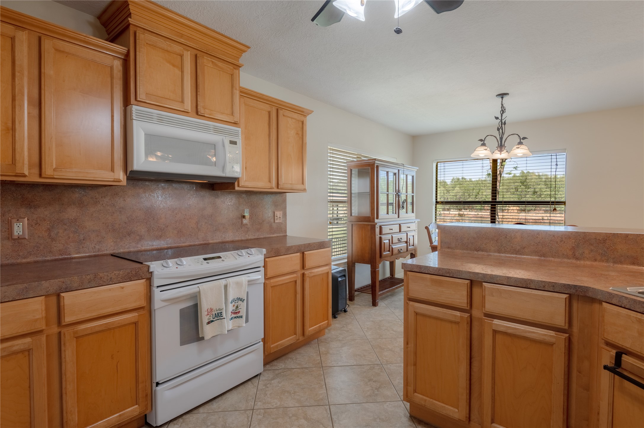 15 Lake Side Trinity, TX 75862 - Photo 6 of 33 a kitchen with a sink stove and cabinets