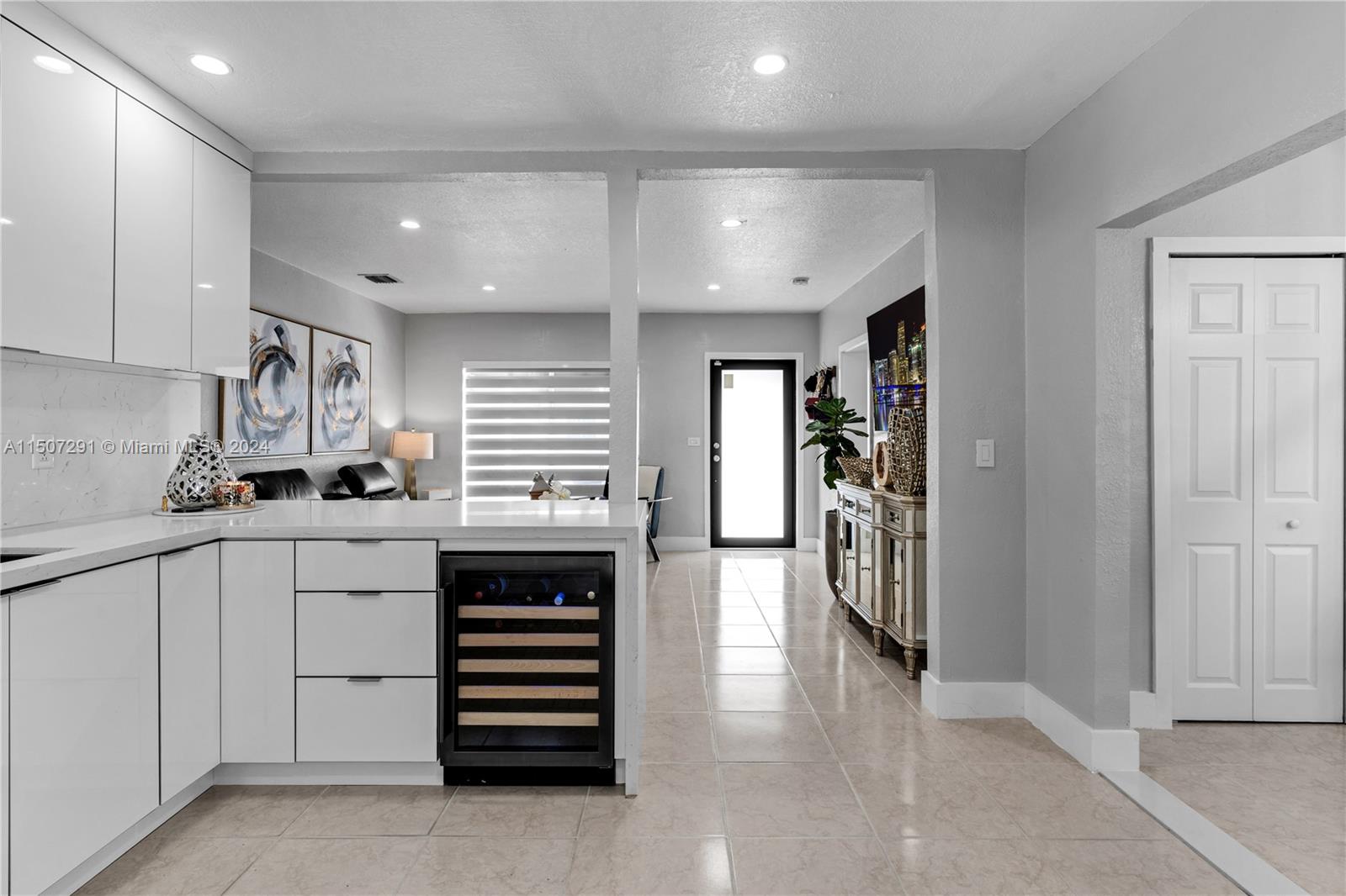 West Little River Miami, FL 33147 - Photo 13 of 29 a kitchen with a refrigerator and white cabinets
