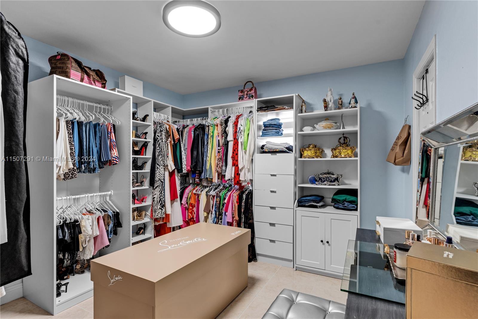 West Little River Miami, FL 33147 - Photo 20 of 29 a view of walk in closet with clothes and shoes