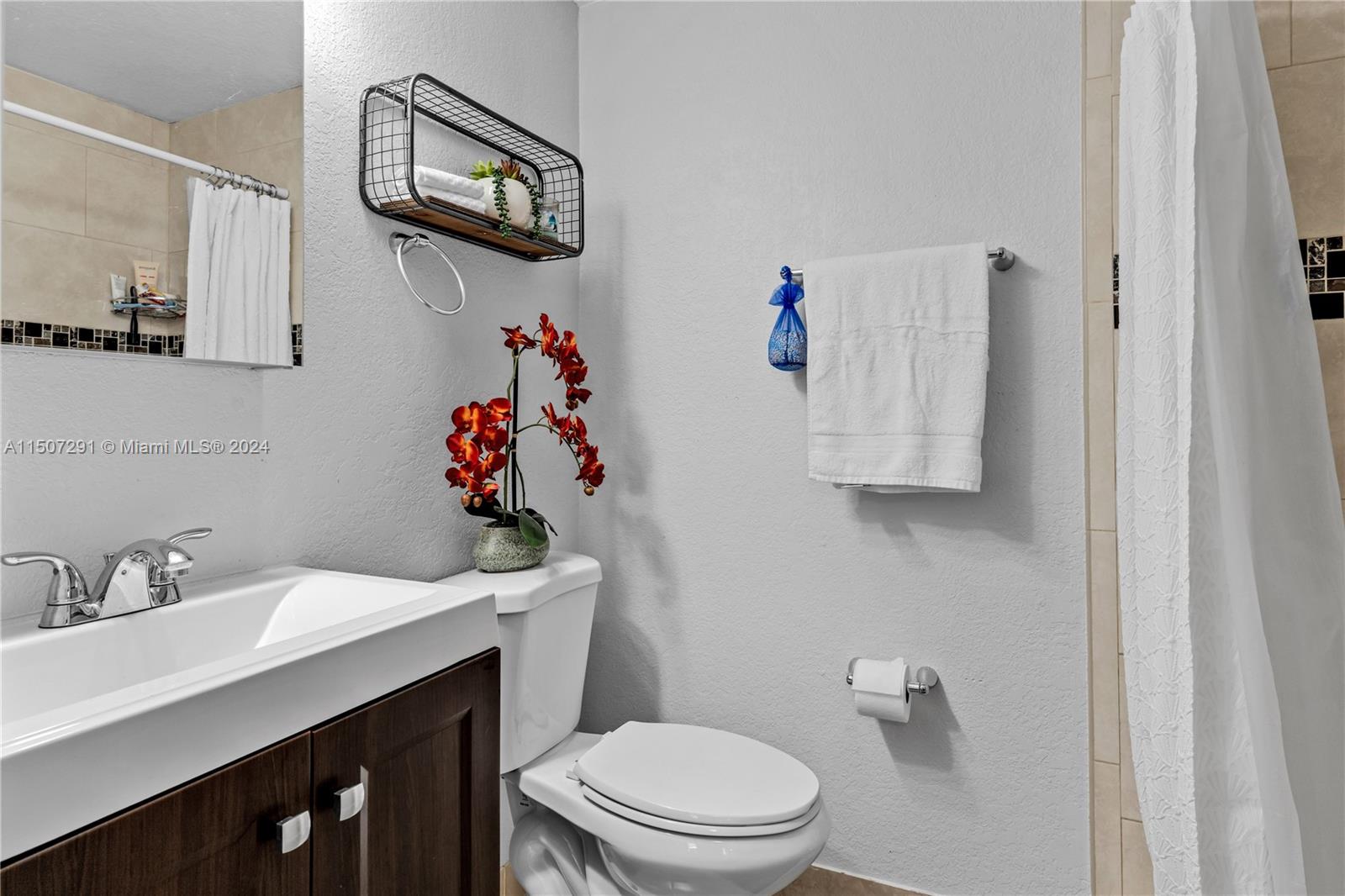 West Little River Miami, FL 33147 - Photo 22 of 29 a bathroom with a sink mirror and toilet