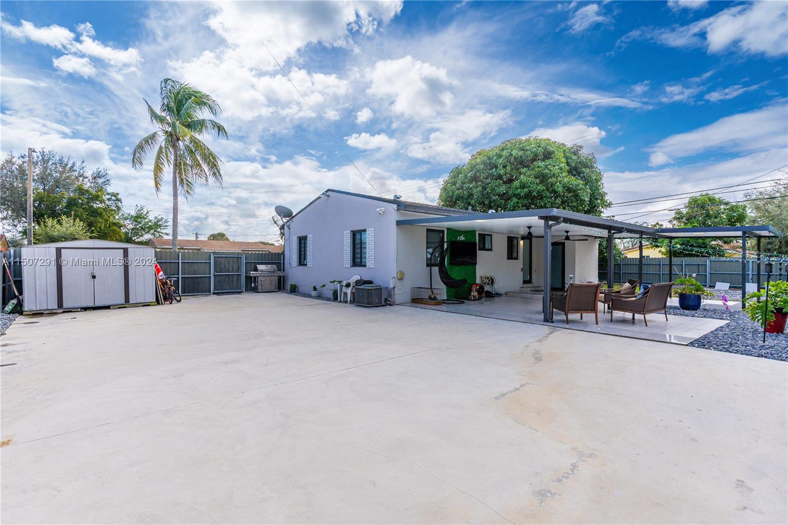 West Little River Miami, FL 33147 - Photo 24 of 29 a view of a house with backyard and sitting area