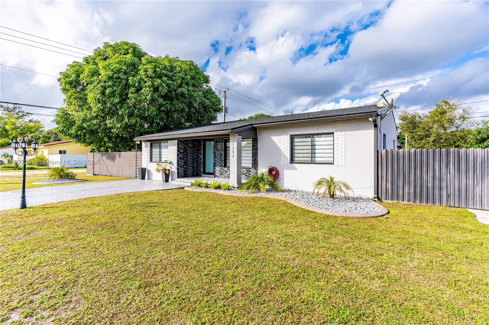 West Little River Miami, FL 33147 - Photo 3 of 29 a view of house with backyard and outdoor seating