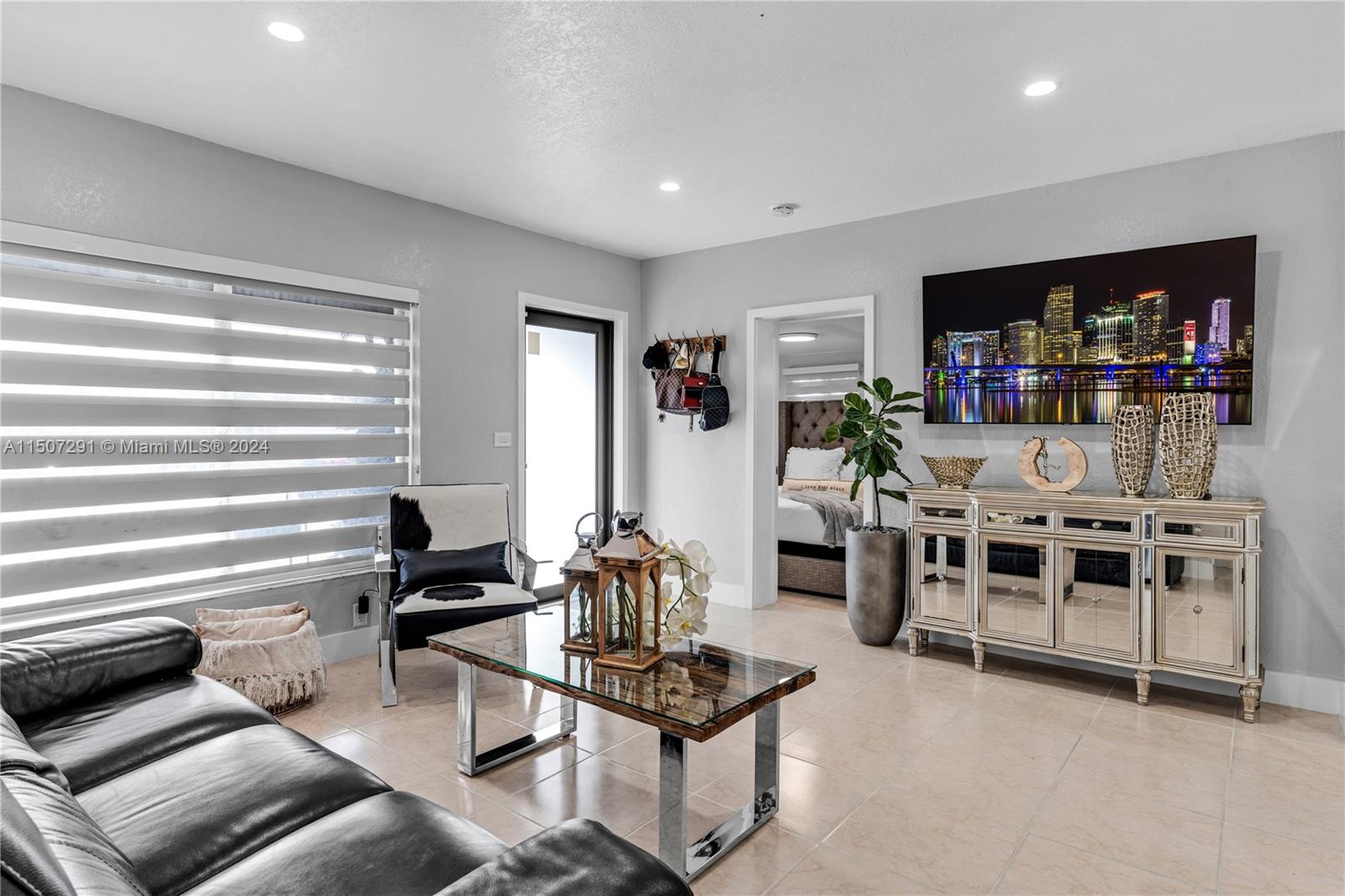 West Little River Miami, FL 33147 - Photo 7 of 29 a living room with furniture and a flat screen tv