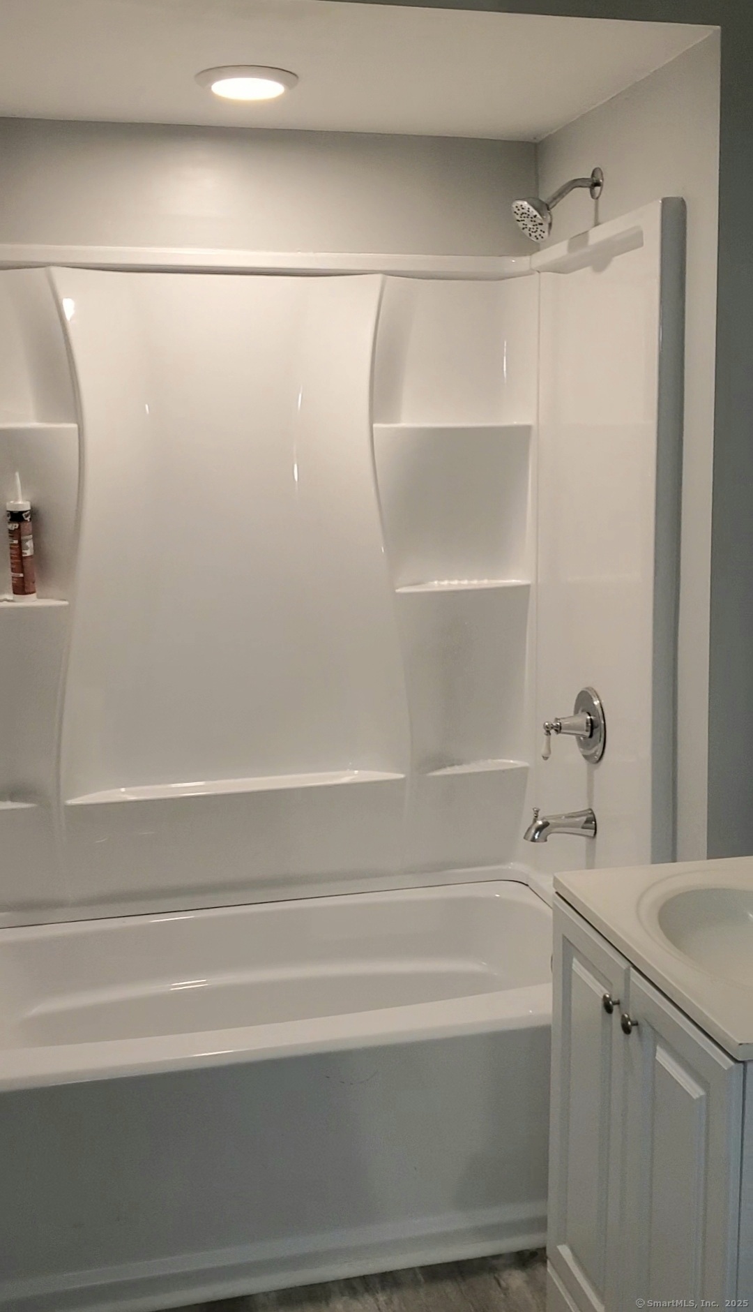 402 Huntington Street New Haven, CT 06511 - Photo 6 of 12 a bathroom with a shower and a bath tub