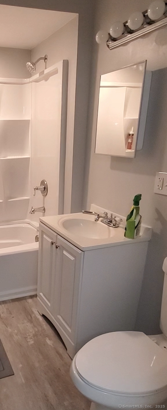 402 Huntington Street New Haven, CT 06511 - Photo 7 of 12 a bathroom with a sink a toilet and bathtub