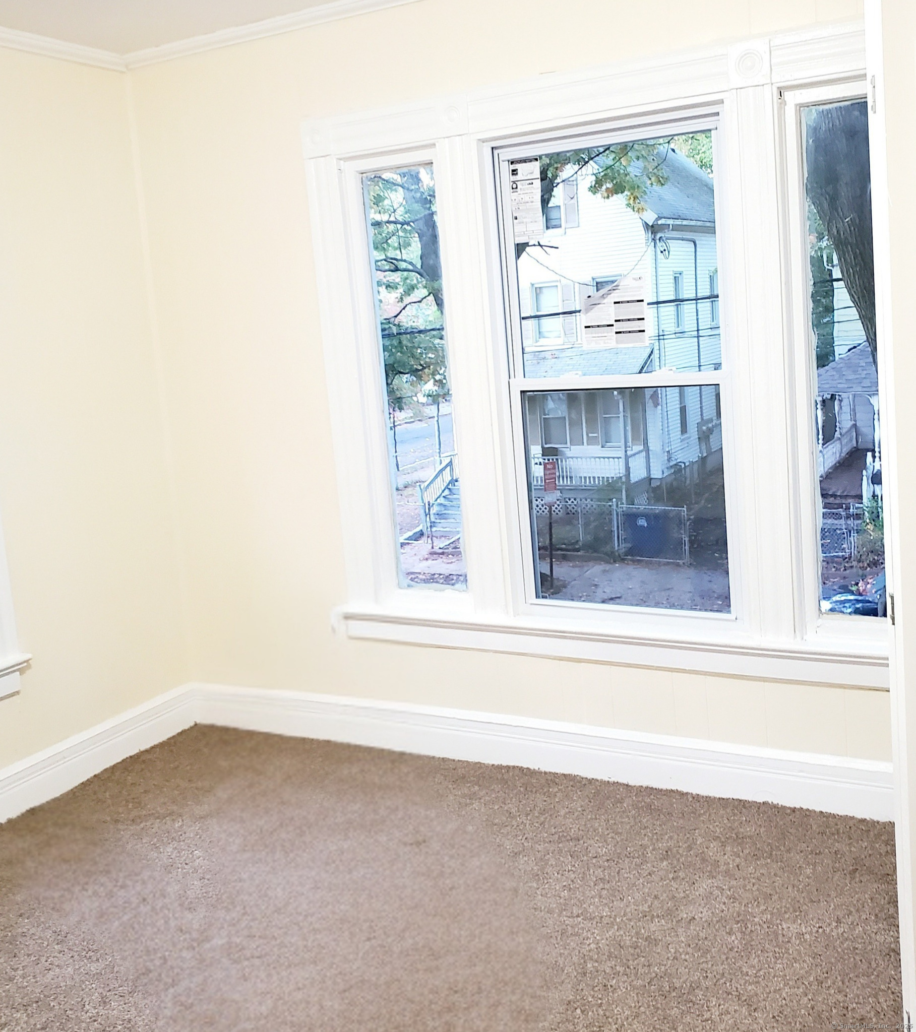 402 Huntington Street New Haven, CT 06511 - Photo 8 of 12 an empty room with a window