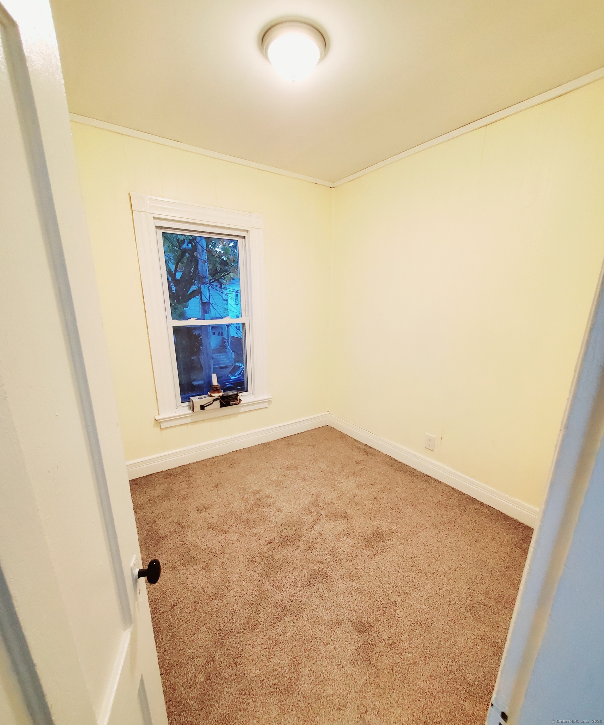 402 Huntington Street New Haven, CT 06511 - Photo 9 of 12 an empty room with a wooden door
