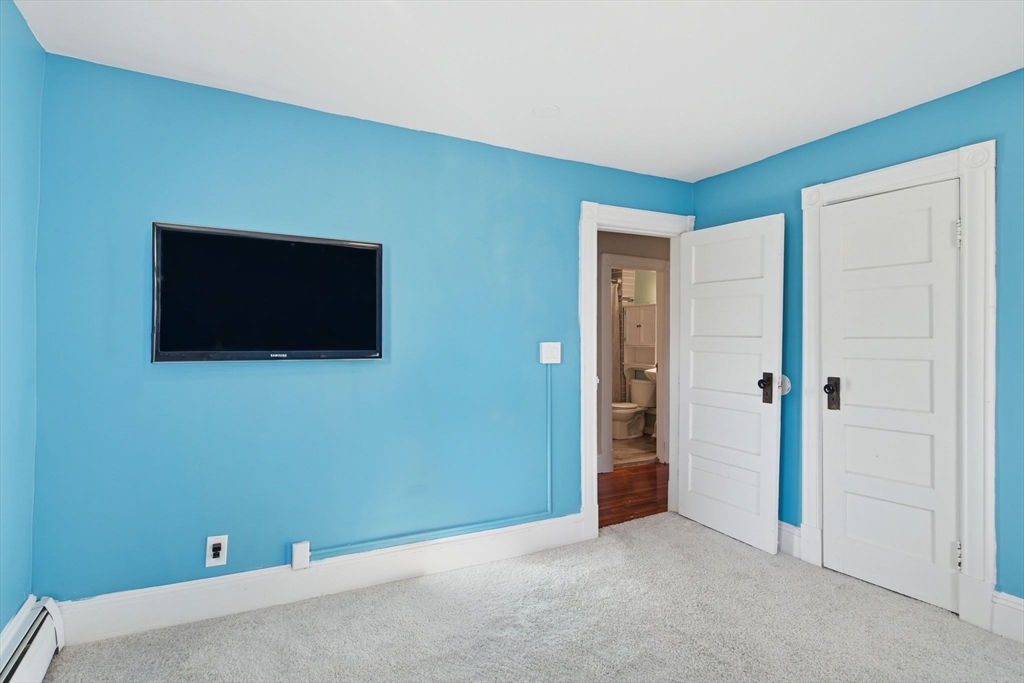 73 Maple Terrace West Springfield, MA 01089 - Photo 23 of 41 a view of an empty room with wooden floor and a flat screen tv