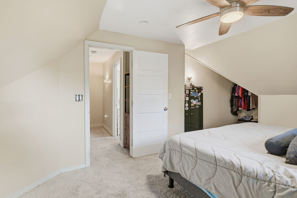 73 Maple Terrace West Springfield, MA 01089 - Photo 31 of 41 a bedroom with a bed and a chandelier