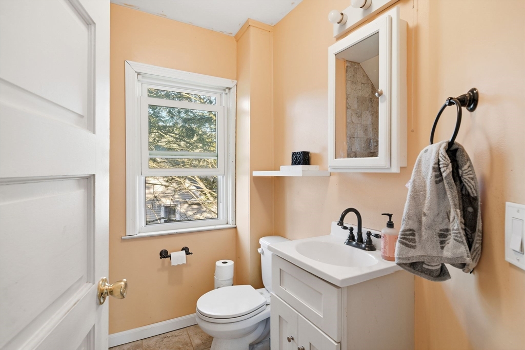 73 Maple Terrace West Springfield, MA 01089 - Photo 33 of 41 a bathroom with a sink a toilet and a window