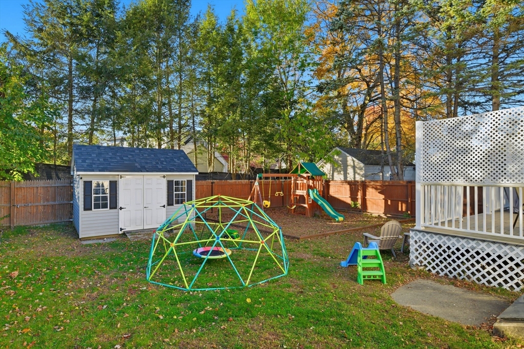 73 Maple Terrace West Springfield, MA 01089 - Photo 36 of 41 a view of a backyard with a table and a slide