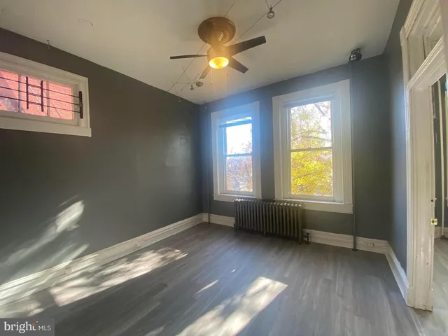 a view of room with window and chandelier fan