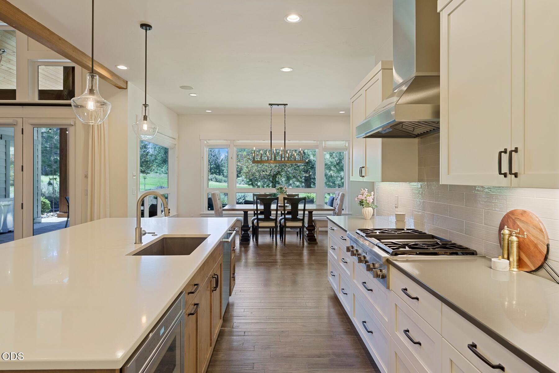 60255 Sunset View Drive Bend, OR 97702 - Photo 14 of 48 a kitchen with sink stove and cabinets