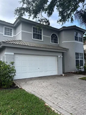 a view of a house with a garage