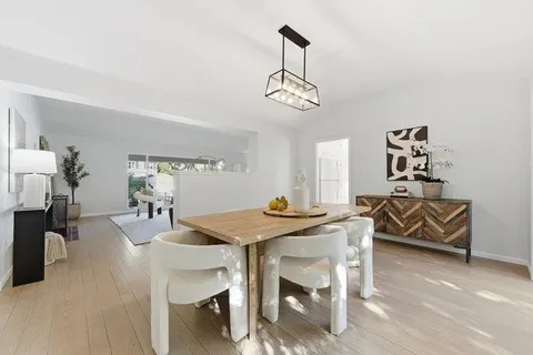 a kitchen with a table and chairs