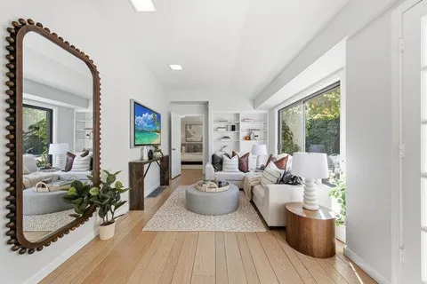 a kitchen with a refrigerator and cabinets