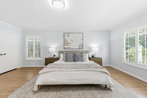 a bedroom with a bed and a couch