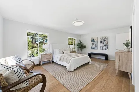 a bedroom with a bed and a couch