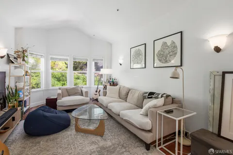 a bedroom with a bed and a book shelf