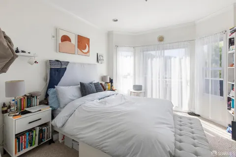 a bathroom with a double vanity sink toilet and shower