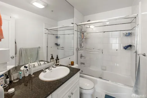 a kitchen with refrigerator stove and sink