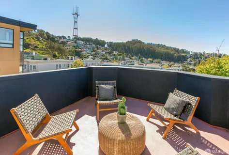 a wooden bench sitting in front of a building