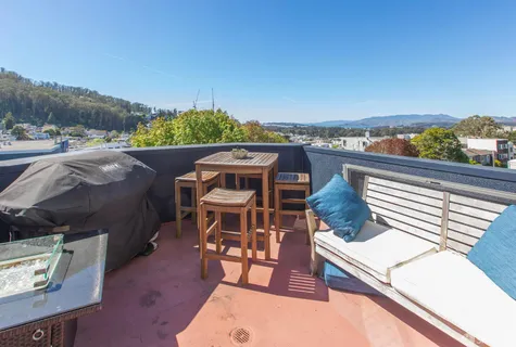 a view of a chairs and table in the patio
