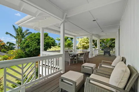 a outdoor view with a sitting space and glass windows