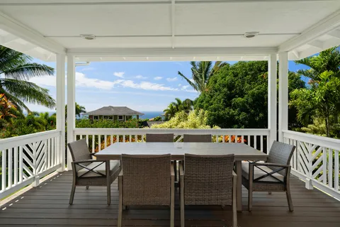a view of a chairs and table in patio