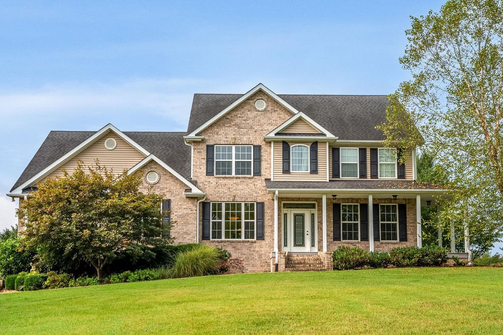 181 Dry Fork Road South Bethpage, TN 37022 - Photo 1 of 52 a front view of a house with garden and porch