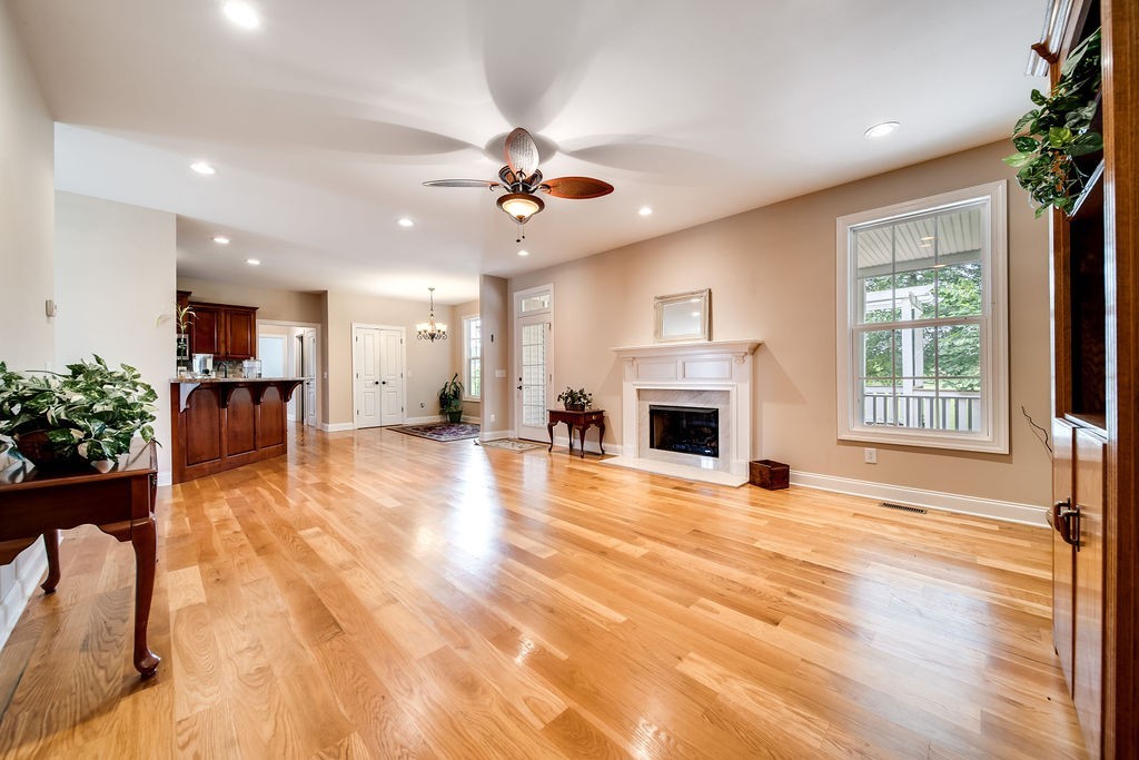 181 Dry Fork Road South Bethpage, TN 37022 - Photo 15 of 52 a view of an empty room with a fireplace and wooden floor