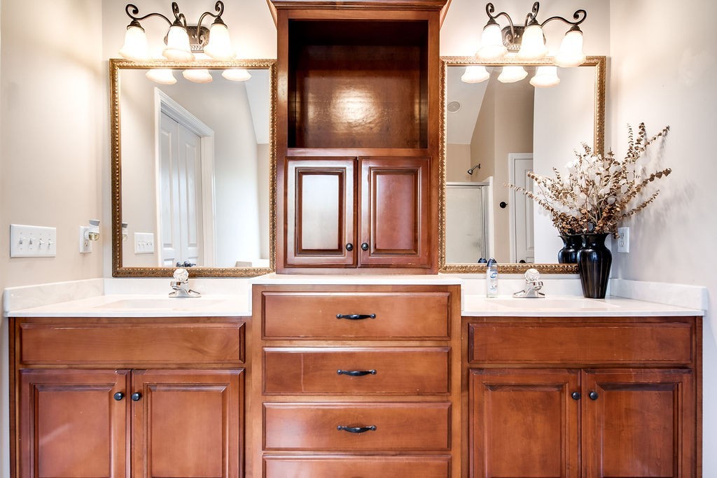 181 Dry Fork Road South Bethpage, TN 37022 - Photo 27 of 52 a bathroom with a sink vanity and a mirror
